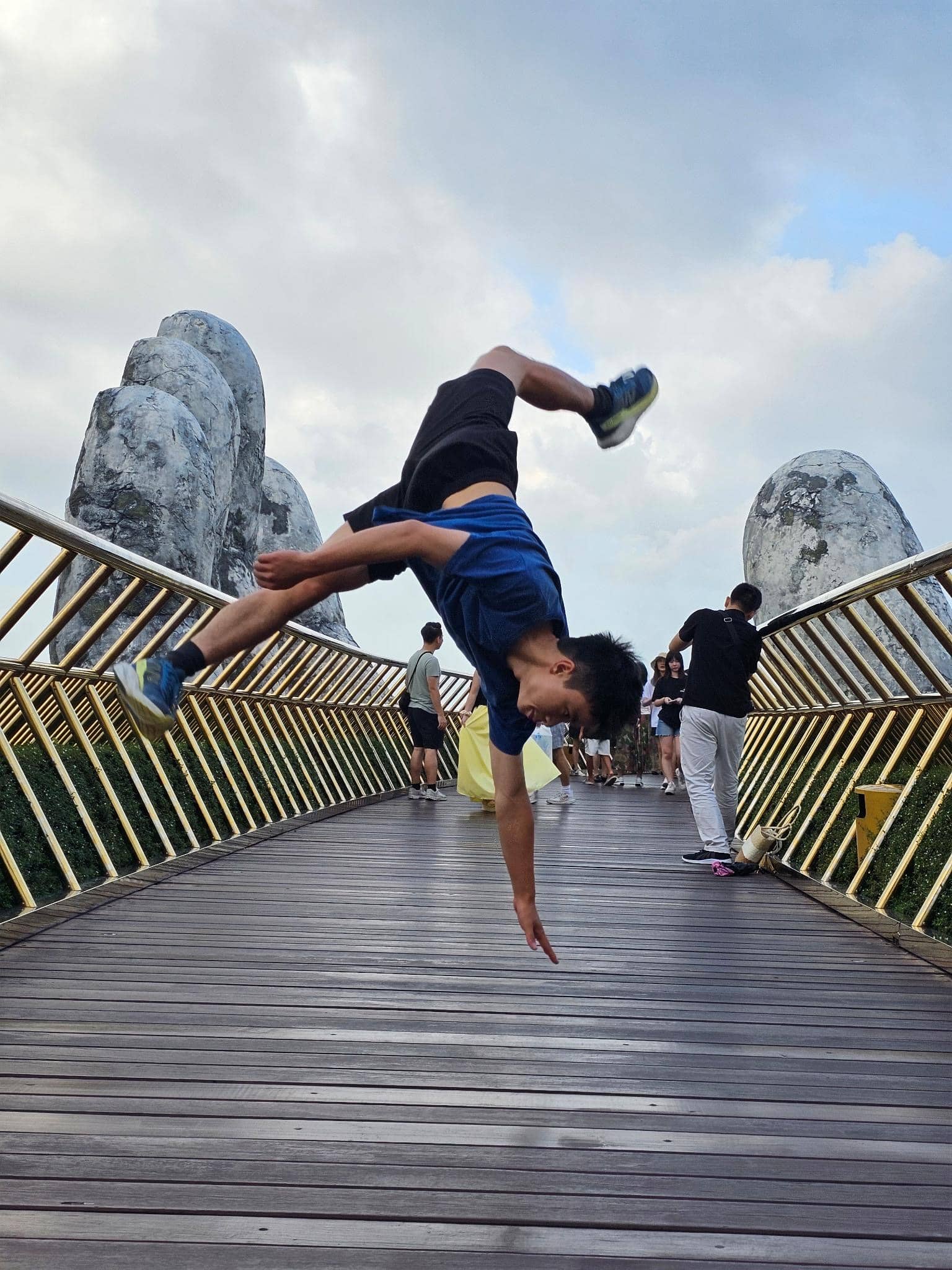 Ethan practicing kung fu on a bridge